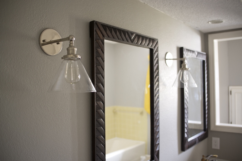 mirrors and sconce side by side