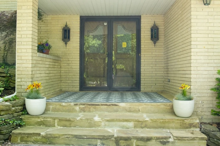 Yellow brick and double front doors picture of the porch