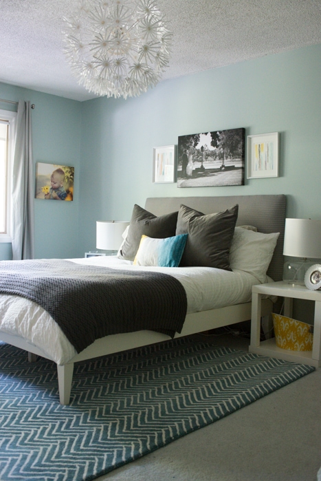 master bedroom with frame art over bed