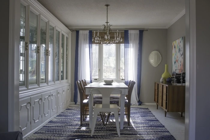 formal dining room with bright blue and white colors