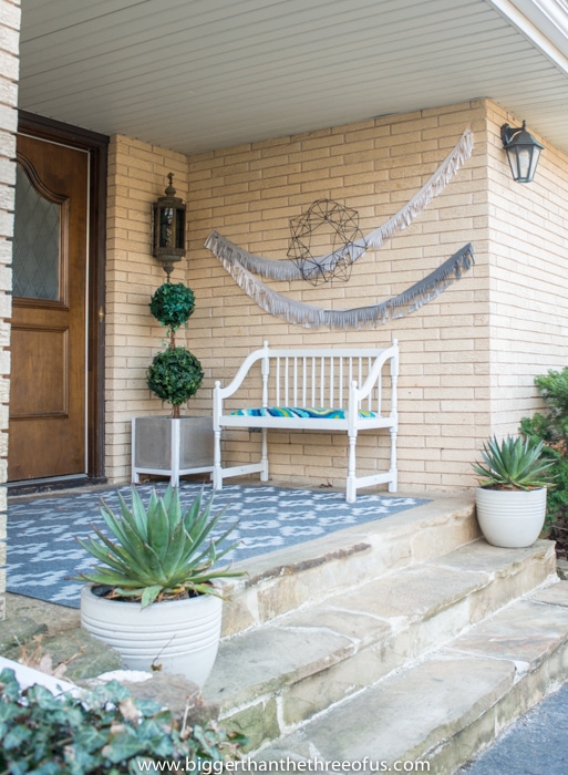 Front Porch with bunting and DIY wreath and rug