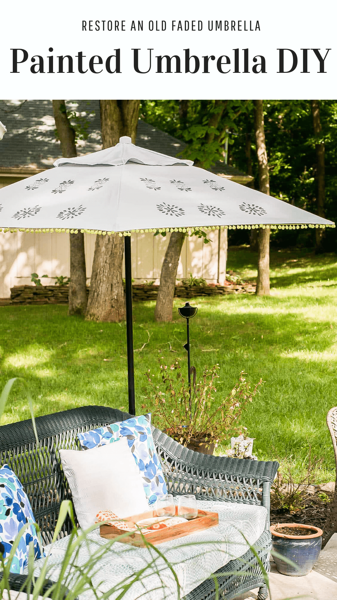 Outdoor fabric paint makeover on patio umbrella. Make a faded umbrella look brand new with this project idea!