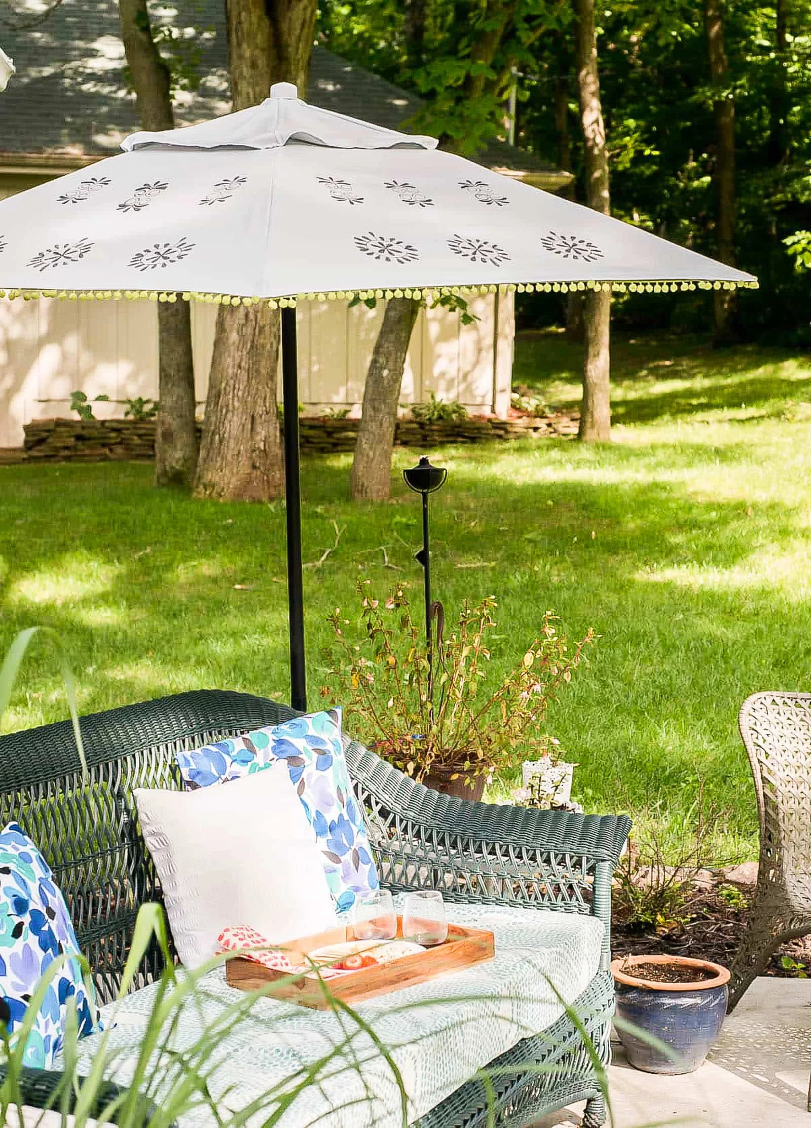 Outdoor fabric paint to refresh an old umbrella by painting it. 