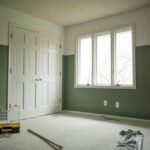 Half painted moody and bright guest bedroom