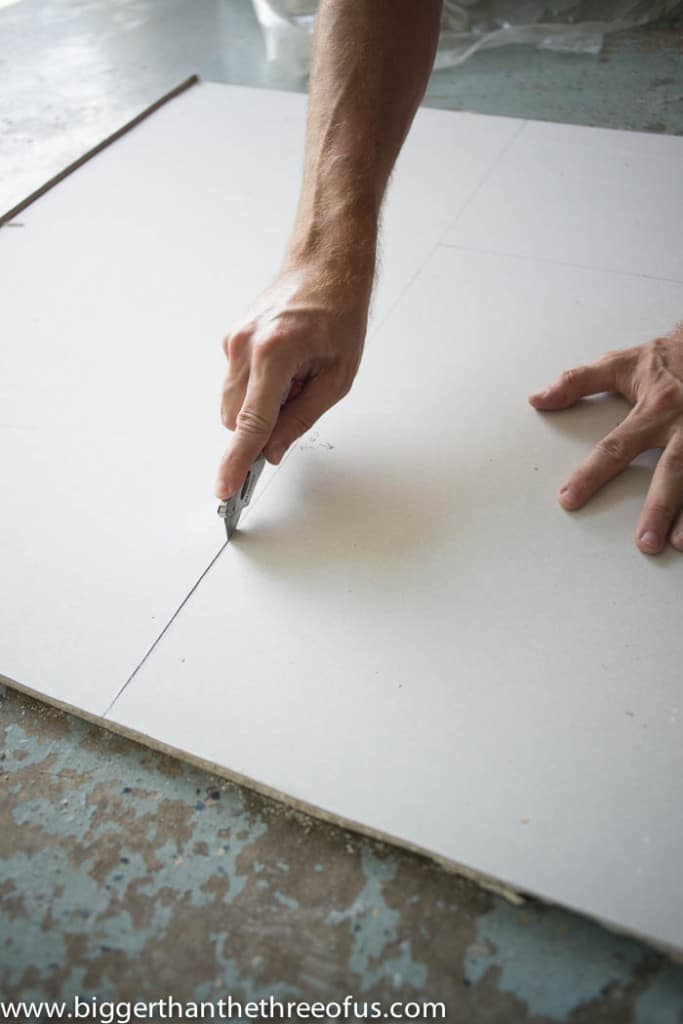 drywall installation showing how to score sheetrock