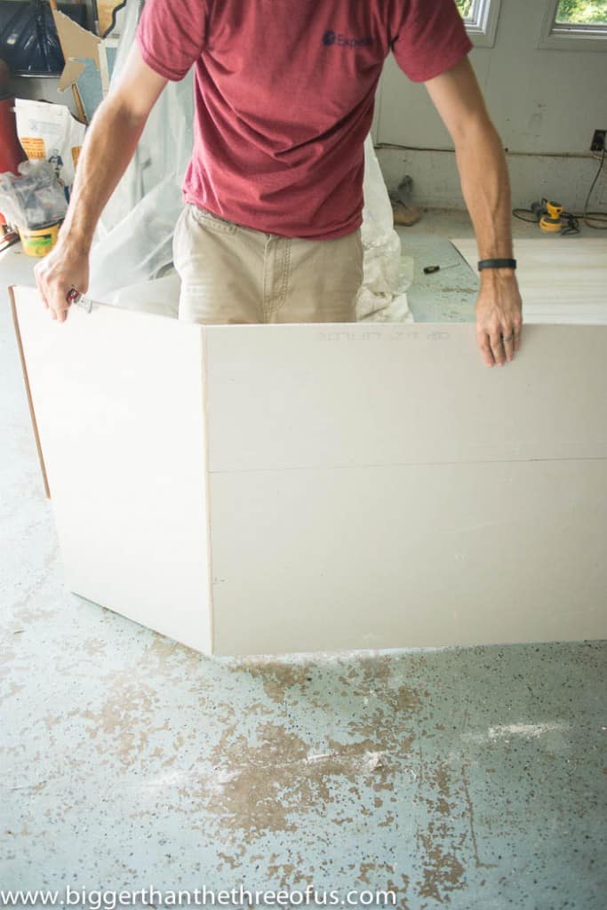 showing how to break sheetrock to install 