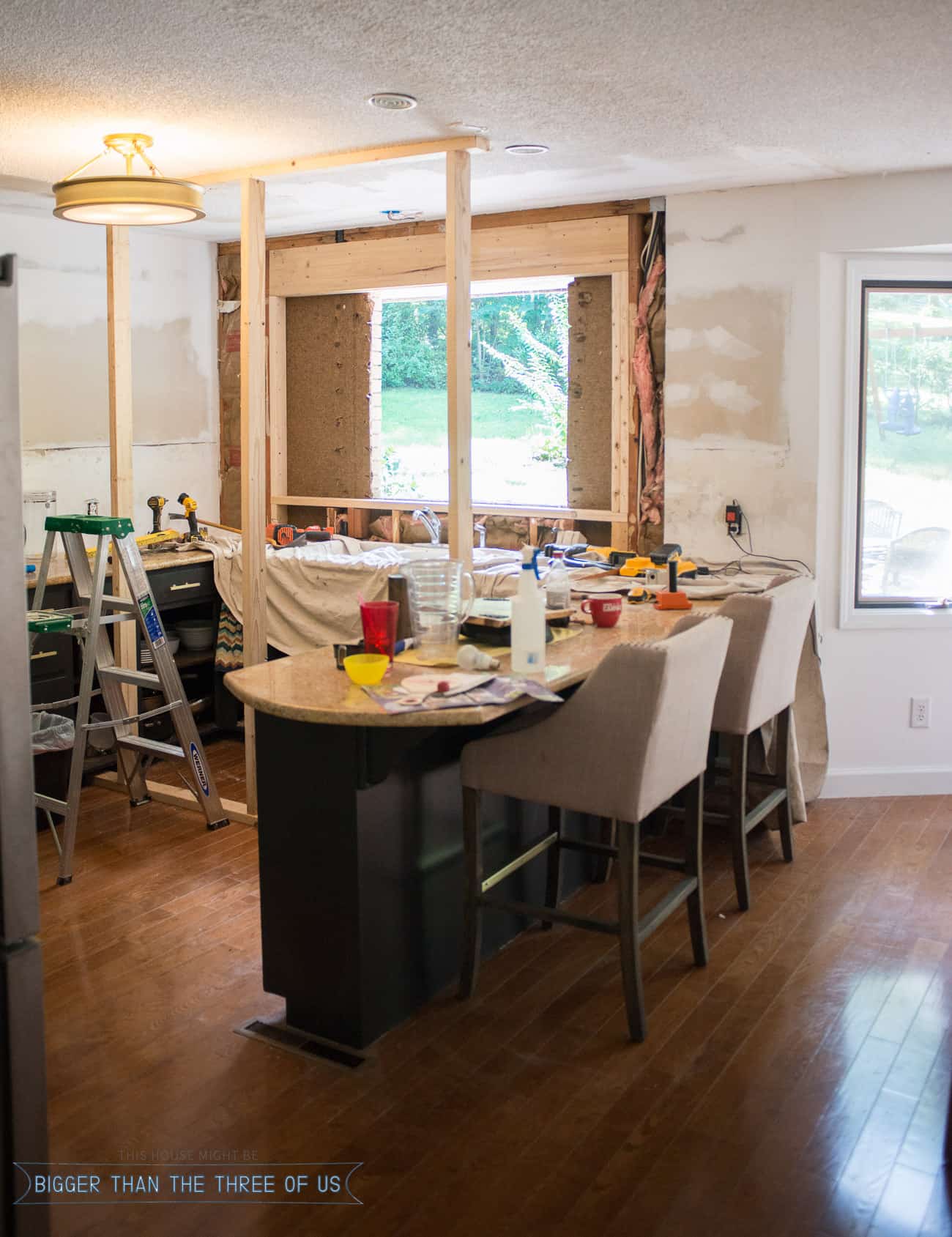 Adding a support beam to kitchen ceiling while cutting into existing brick