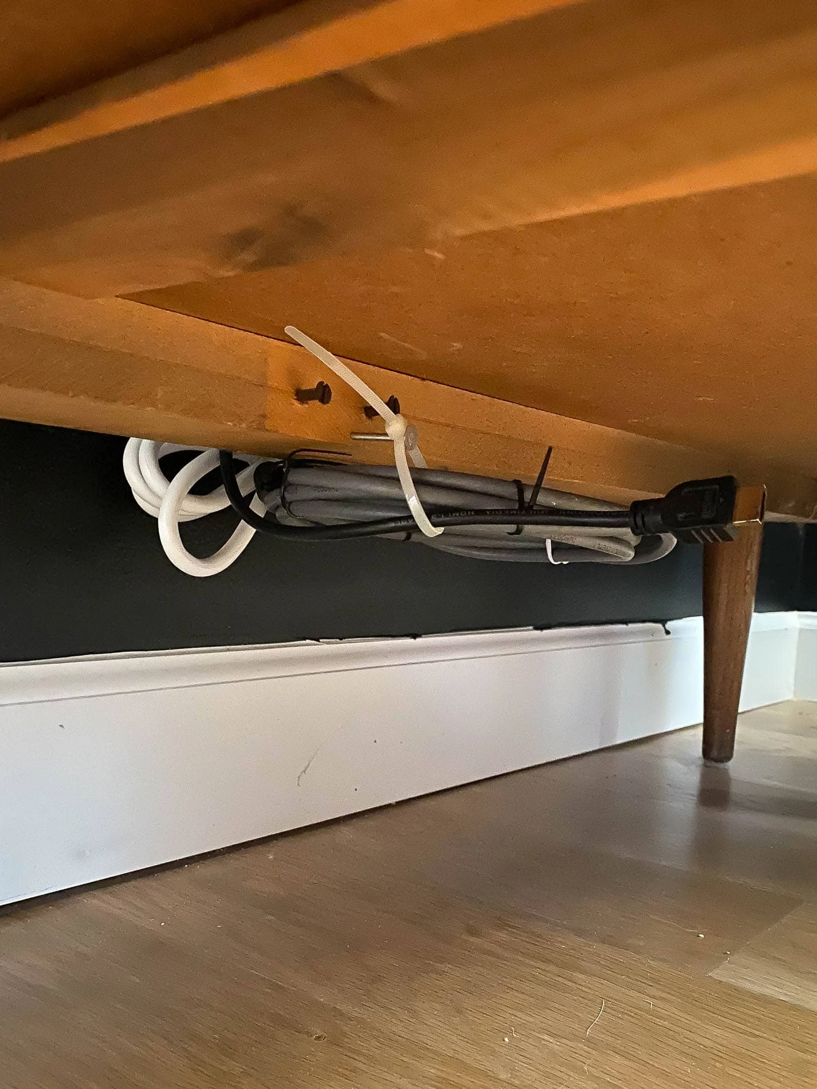 showing cable ties to hide cords under cabinet 