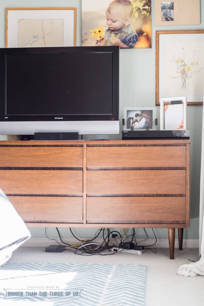 Hide the cords under a media cabinet (BEFORE)