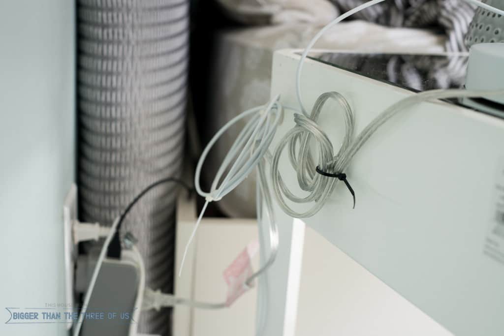 All about Cord Management including hiding those pesky bedside table lamp cords, controlling the cable clutter under a dresser and more! #cableclutter 