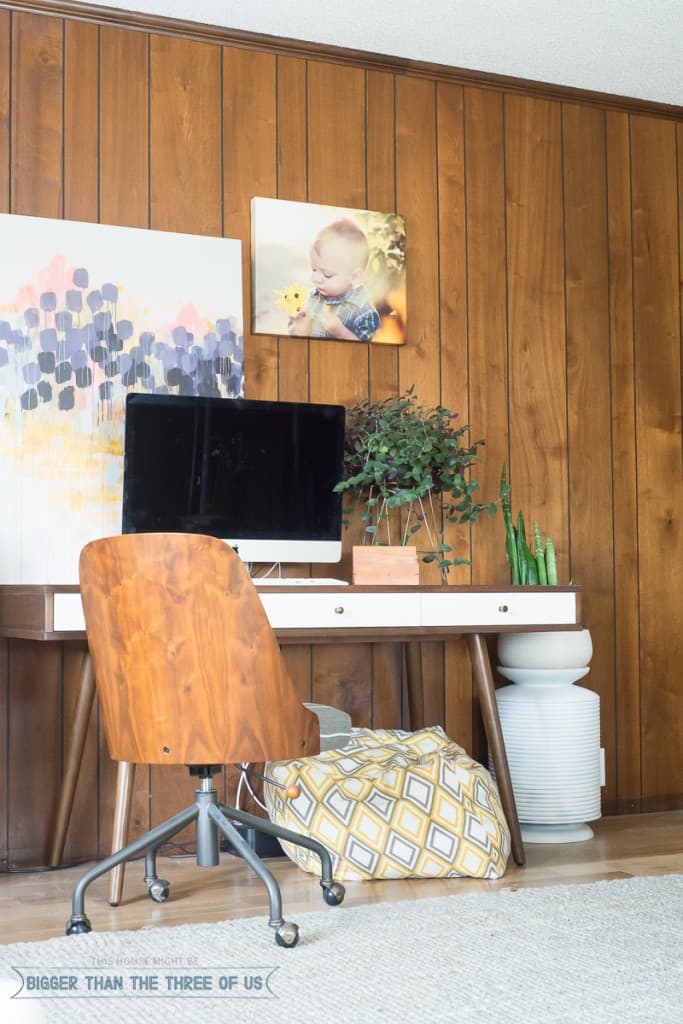 Mid-Century Desk in office with wood paneling 