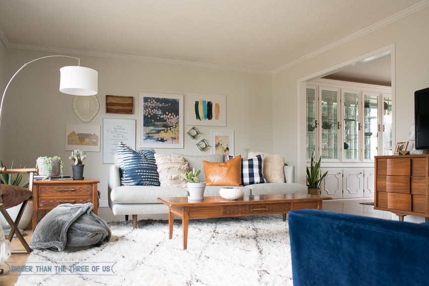 Gallery wall in mid-century bright and modern living room