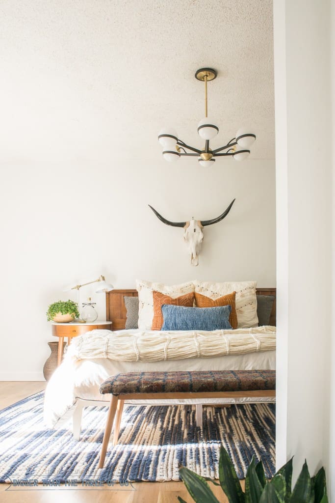 Check out this Mid-Century Bedroom. It has a DIY vintage mid-century bench, and eclectic but minimal touches throughout! 