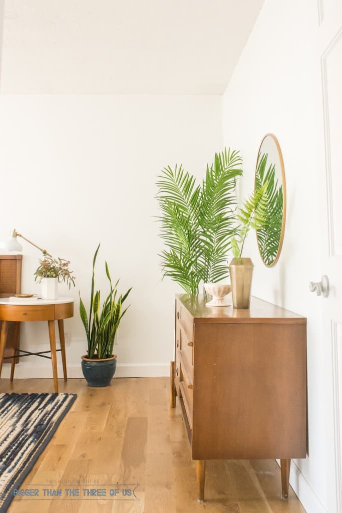 Vintage dresser styling in this mid-century bedroom