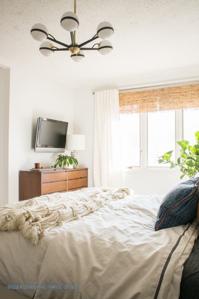 TV styling in bedroom with a vintage dresser