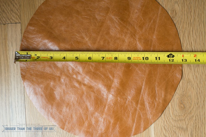 Showing leather cut into a circle to be the bottom of a DIY fabric pot