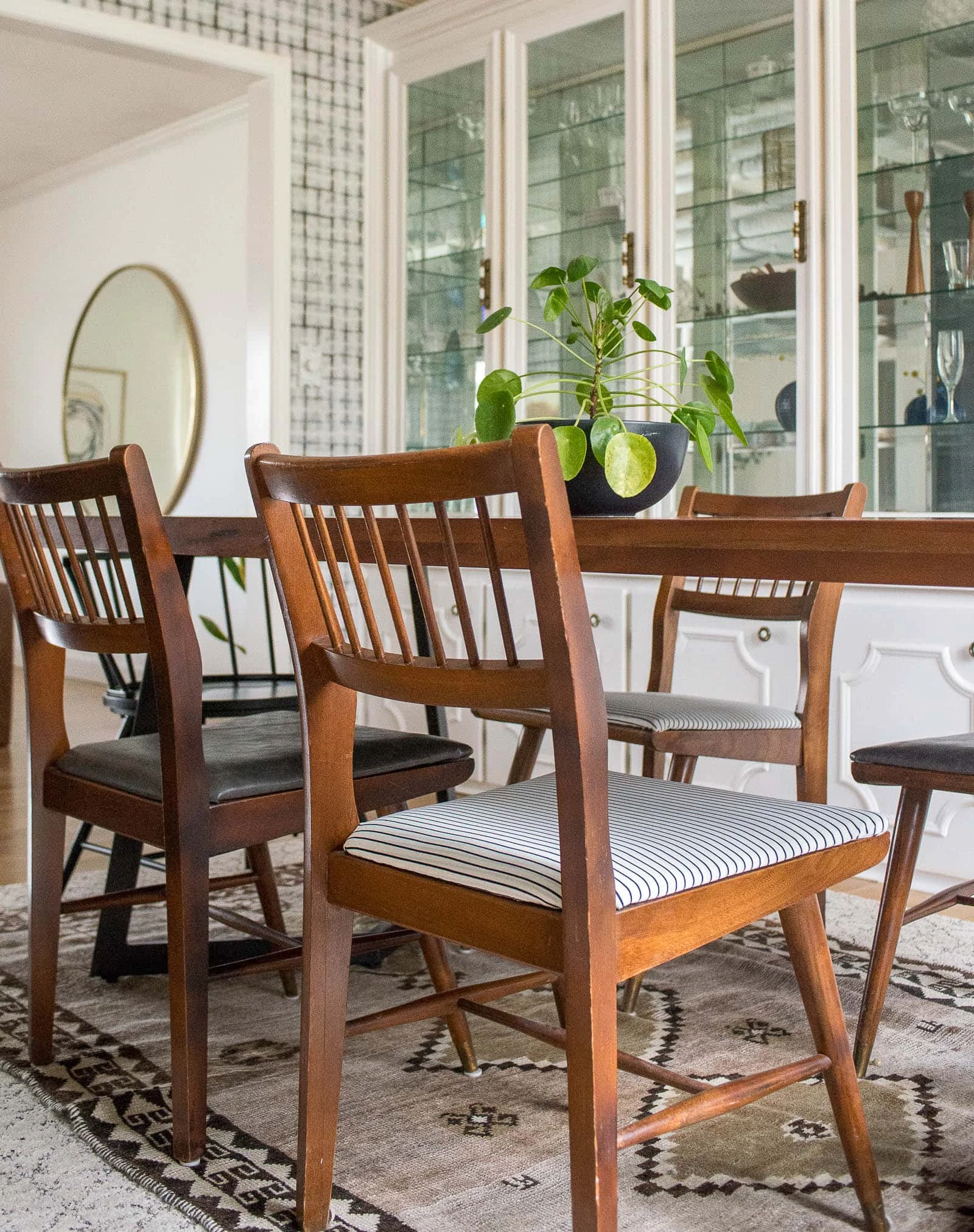 Midcentury dining room chairs around table