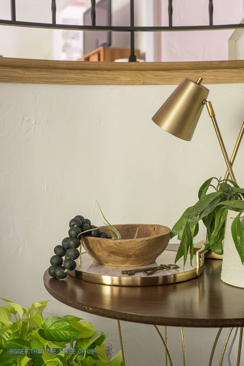 Tabletop styling with lamp, plant and tray 