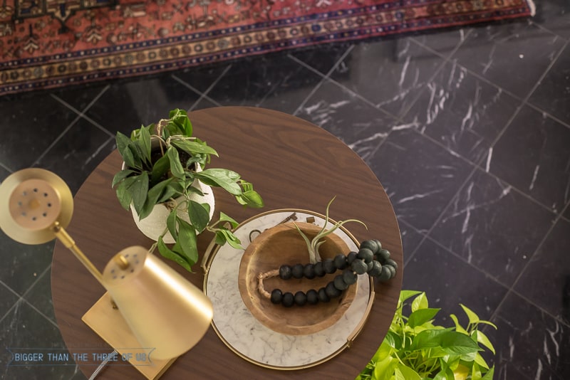 Tabletop styling with lamp, plant, wood bowl and tray