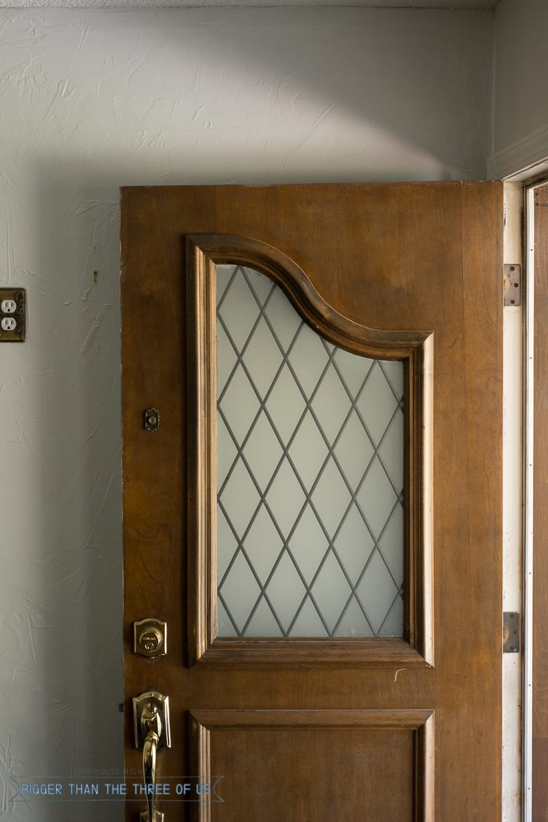 dated window panel in an exterior wood door