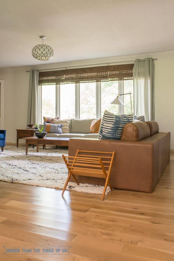 Bohemian living room with shag rug and leather couch 