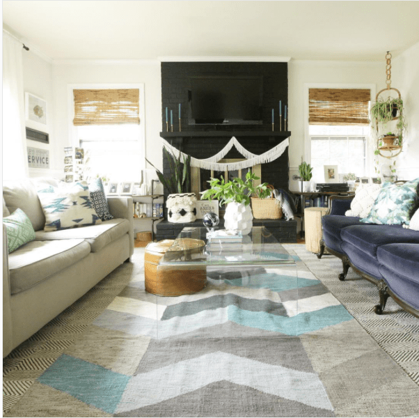 Black painted brick with a black mantle and boho living room decor