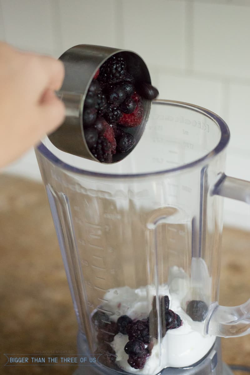 blender with berries and yogurt