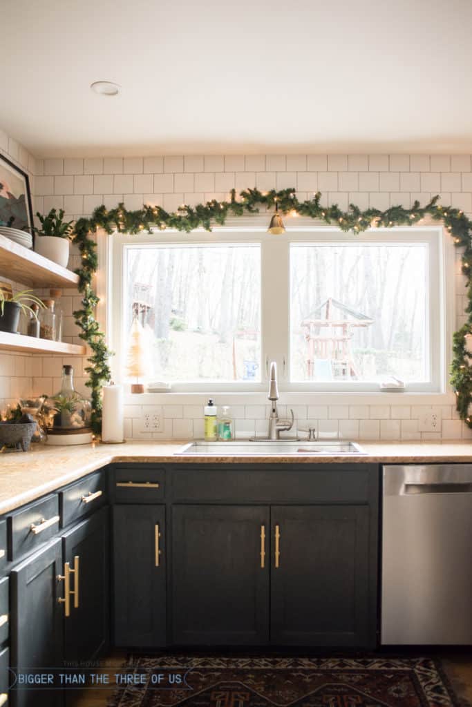 Garland above window over sink in kitchen. 