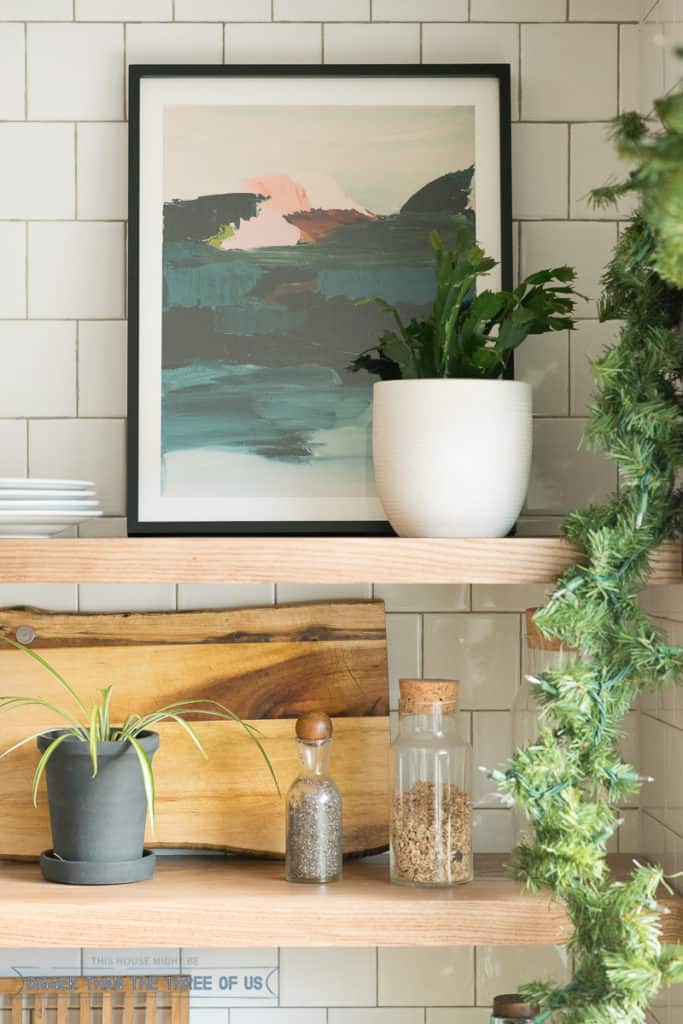 Open Shelves in the Kitchen with art and Christmas Decor