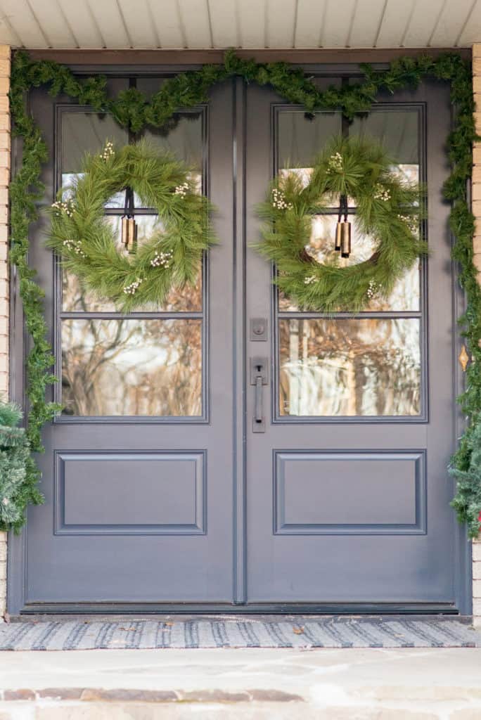 Double front doors with glass decorated for Christmas | Front Porch Christmas Decorating Ideas