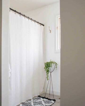 White Curtain in shower gives an airy vibe