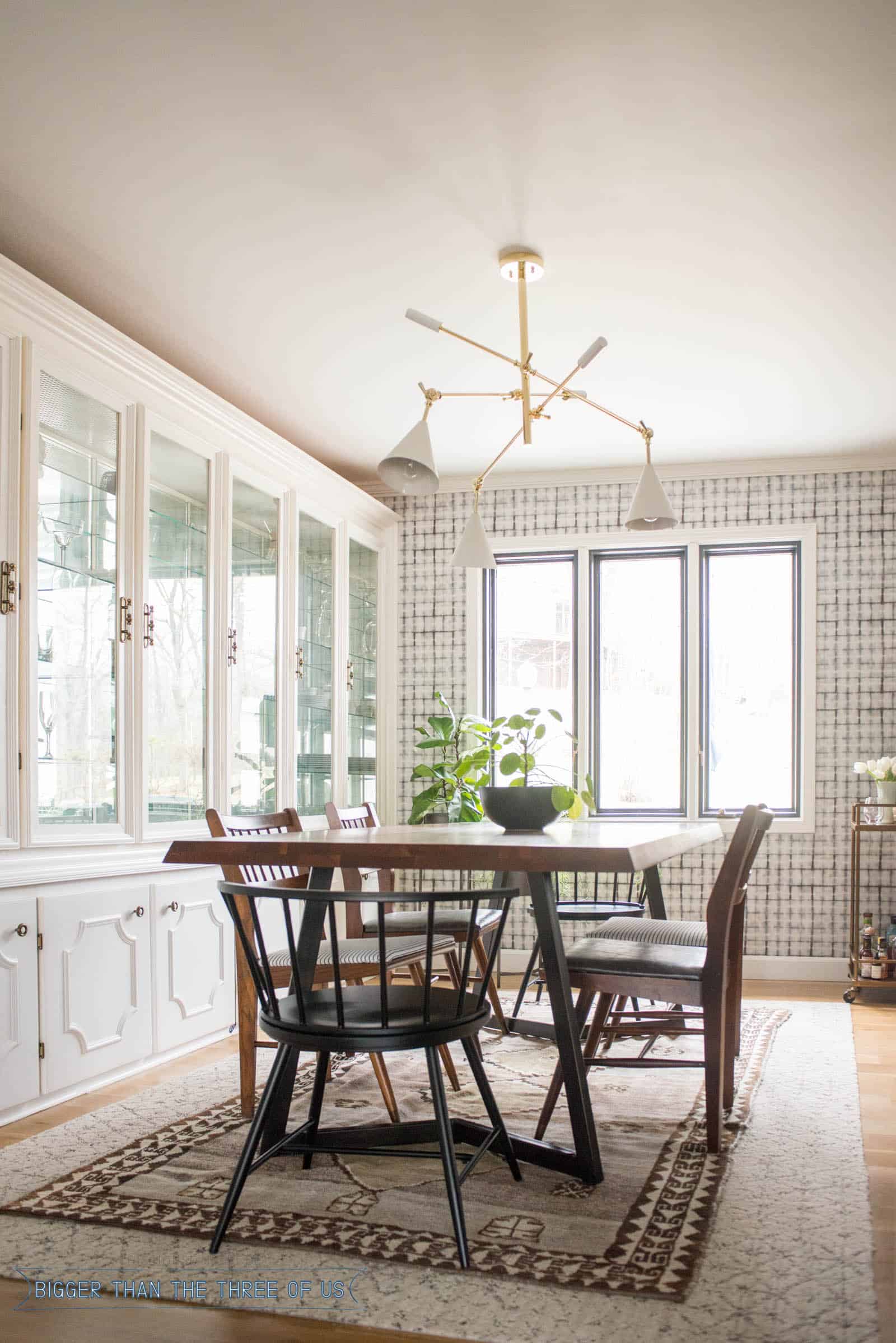 Blue and White vintage dining room with wood floors, wallpaper and midcentury modern furniture