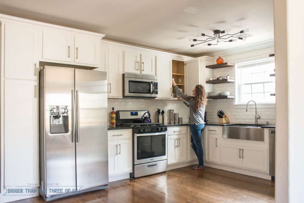 Modern white kitchen with open shelves in our Oklahoma City HomeAway Rental.