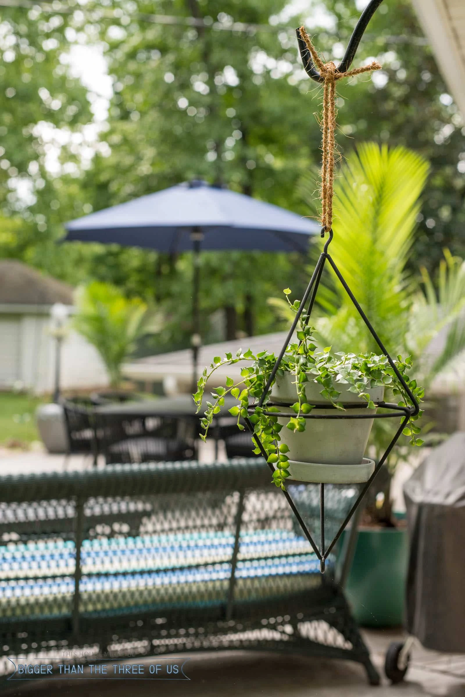 Modern backyard patio reveal with black and blue accent colors