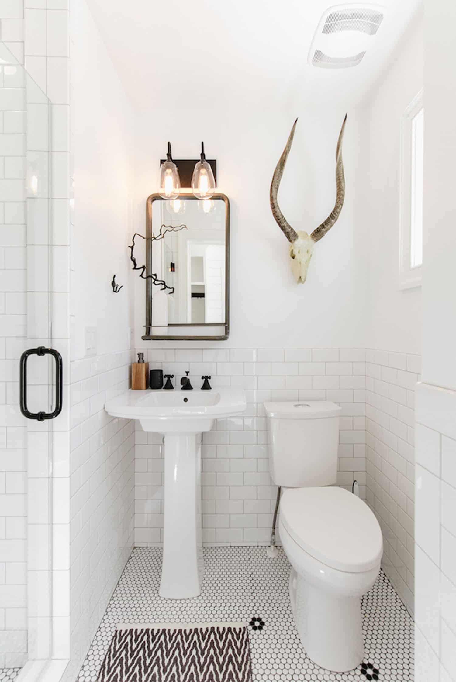 All white powder bathroom with unique art | Design Make and Live Powder Bathrooms on this episode of the Your Home Story Podcast #podcast #powderbathroom