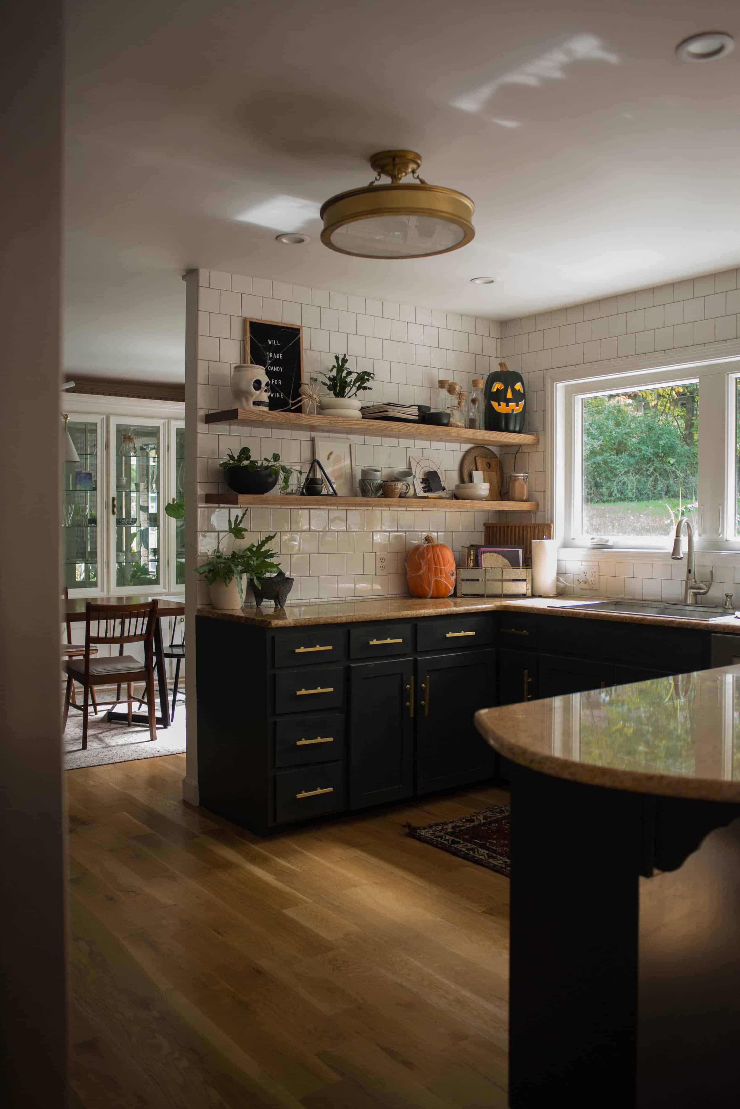 Brass and Black Kitchen with Halloween Decor