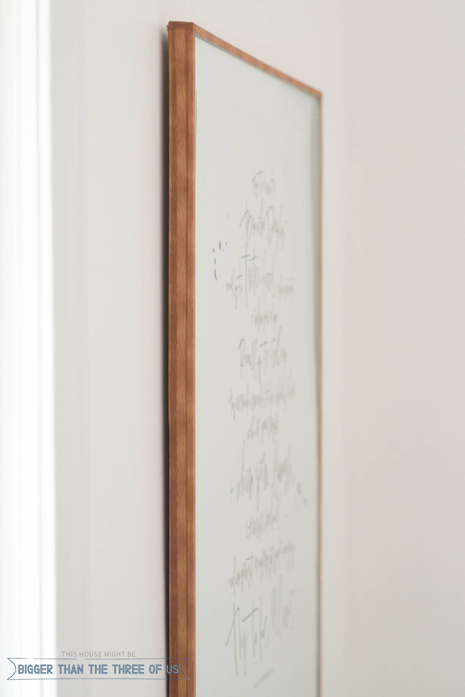 Closeup of faux wood frame using wood grain tape