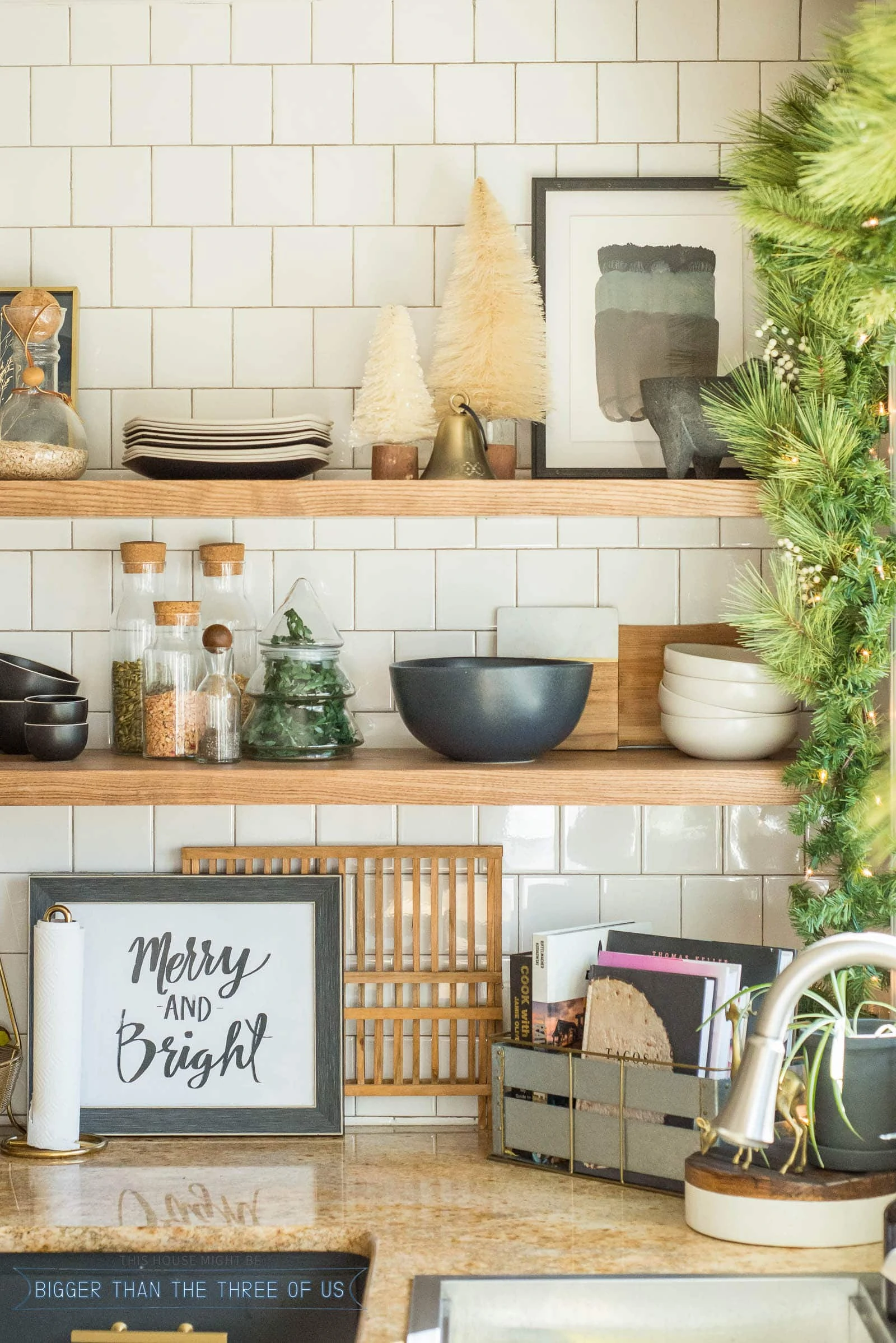 Closeup of ash floating shelves in kitchen decorated for Christmas