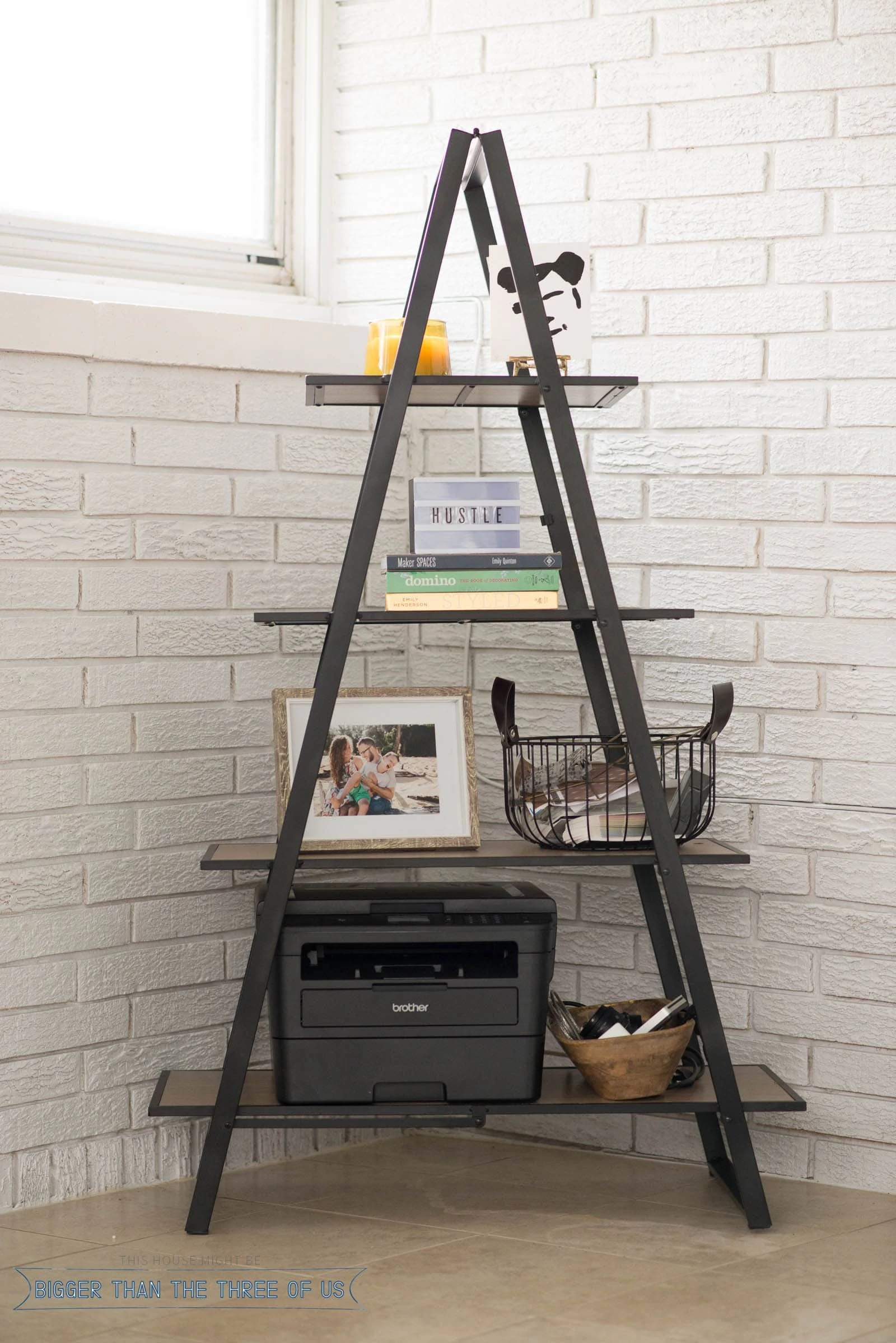 Close-up of A frame shelf in office with printer, basket and office decor styled on the shelves.