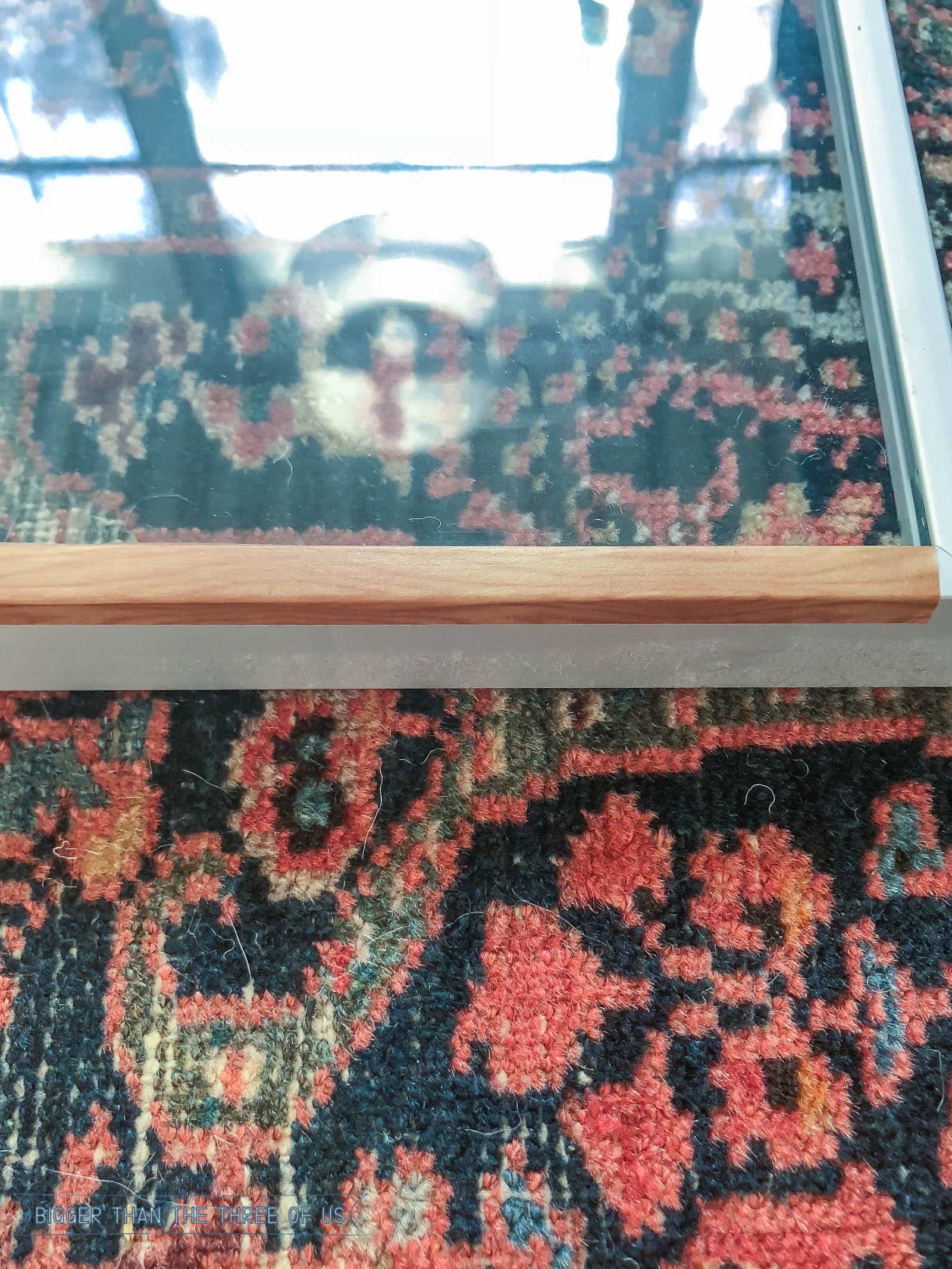 Progress photo of metal frame being transformed with wood grain tape