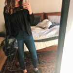 Date night outfit: jeans and slides with leather coat