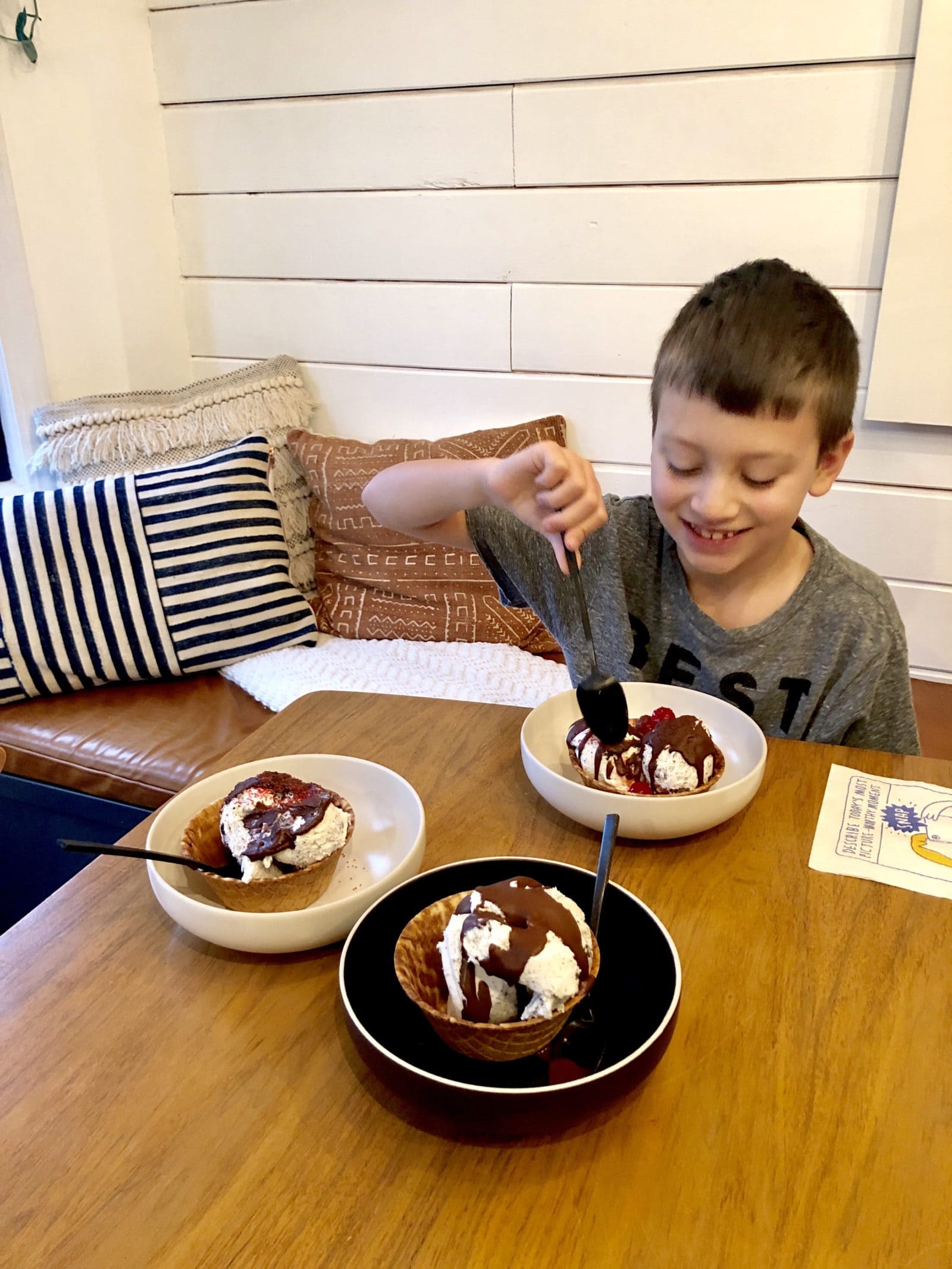 Ice cream sundae with kid smiling