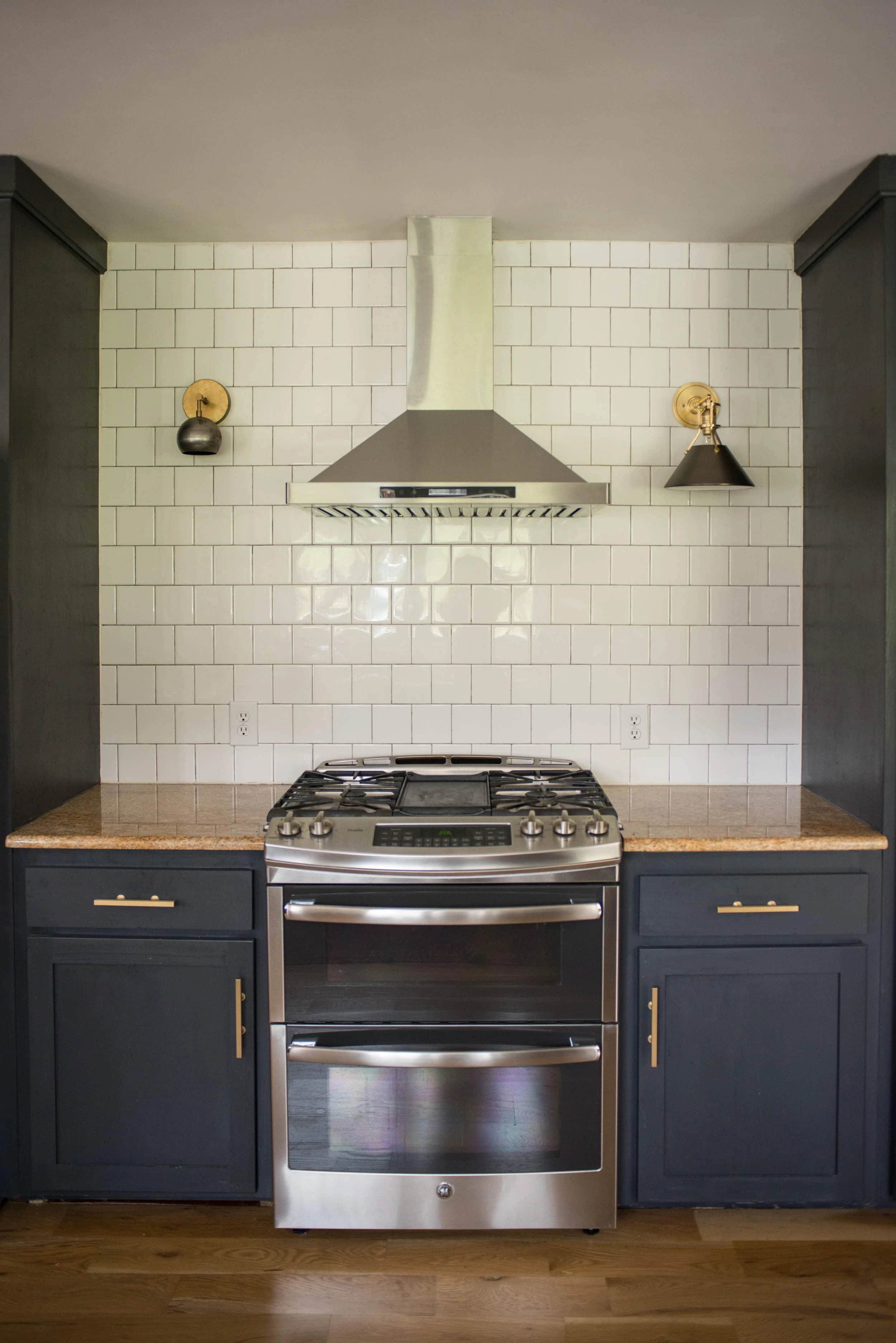 Different kitchen sconces showing scale on each side of oven.