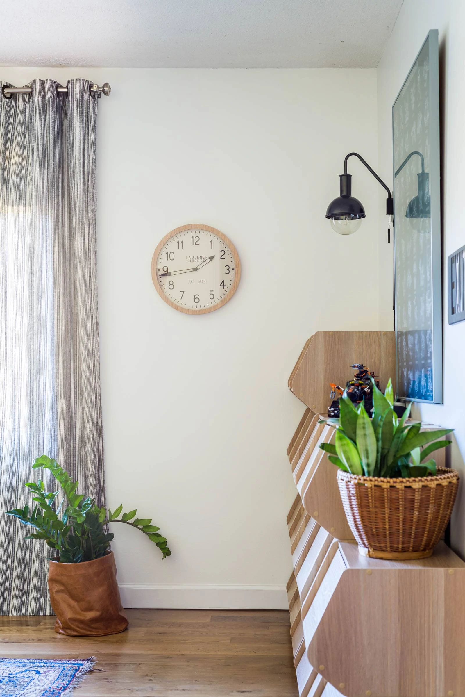 Boy Bedroom with wall sconce and wall clock and lego storage