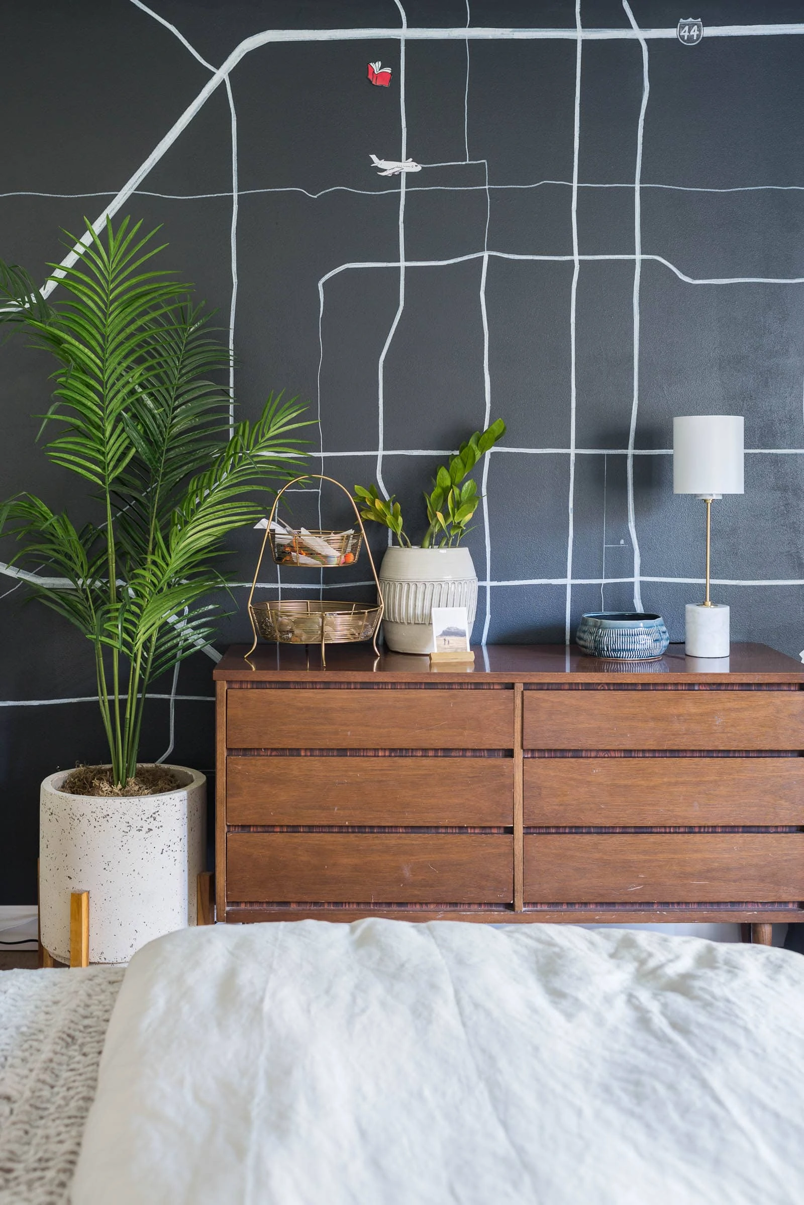 Wall map with vintage dresser