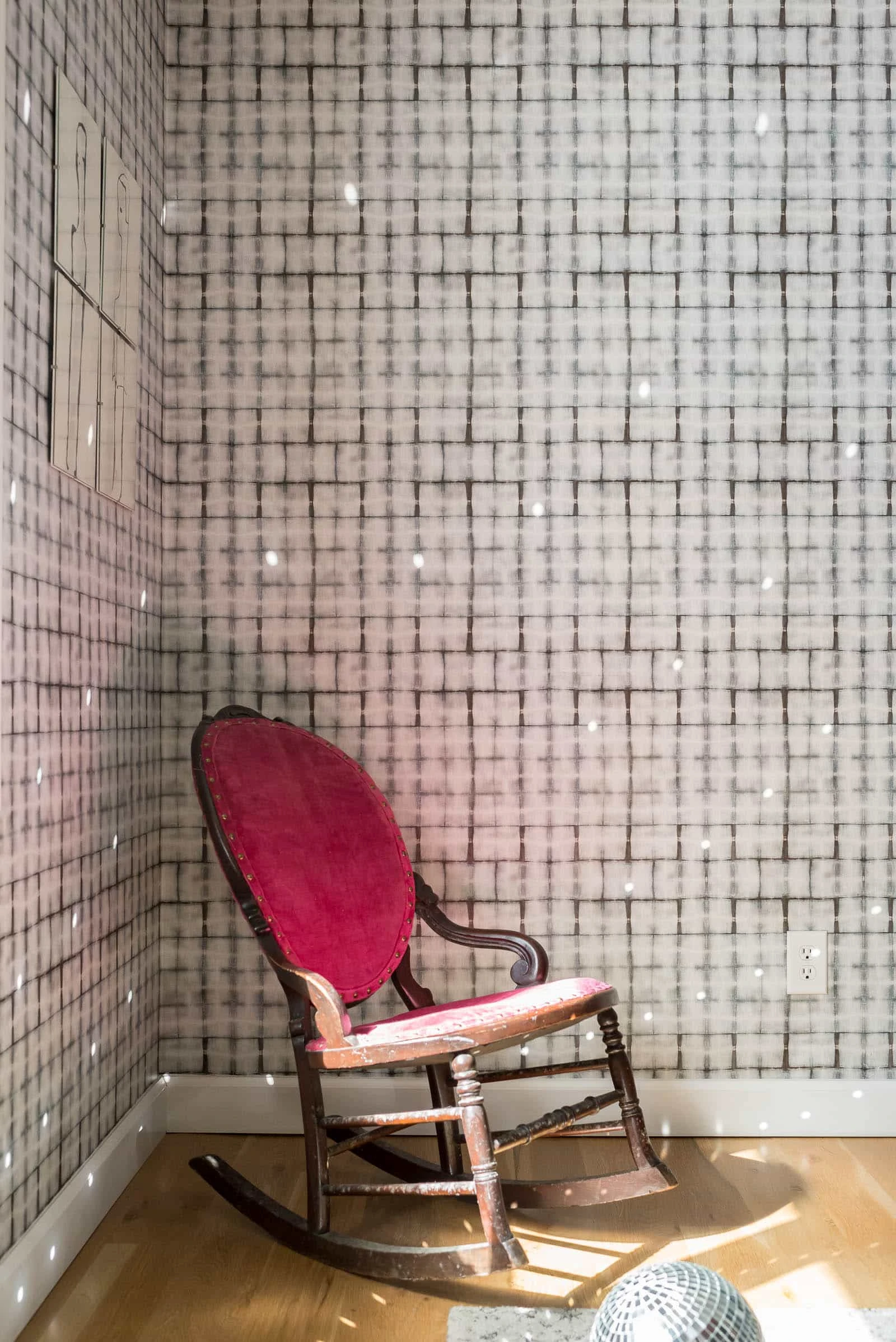 Wallpaper in dining room with vintage sewing chair