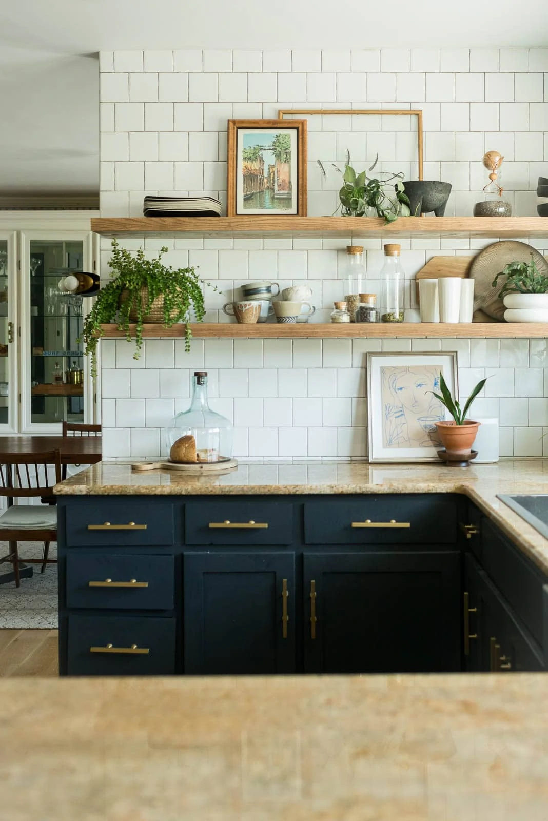 What my mat and frames of art pieces look like in my kitchen on the open kitchen shelves. 