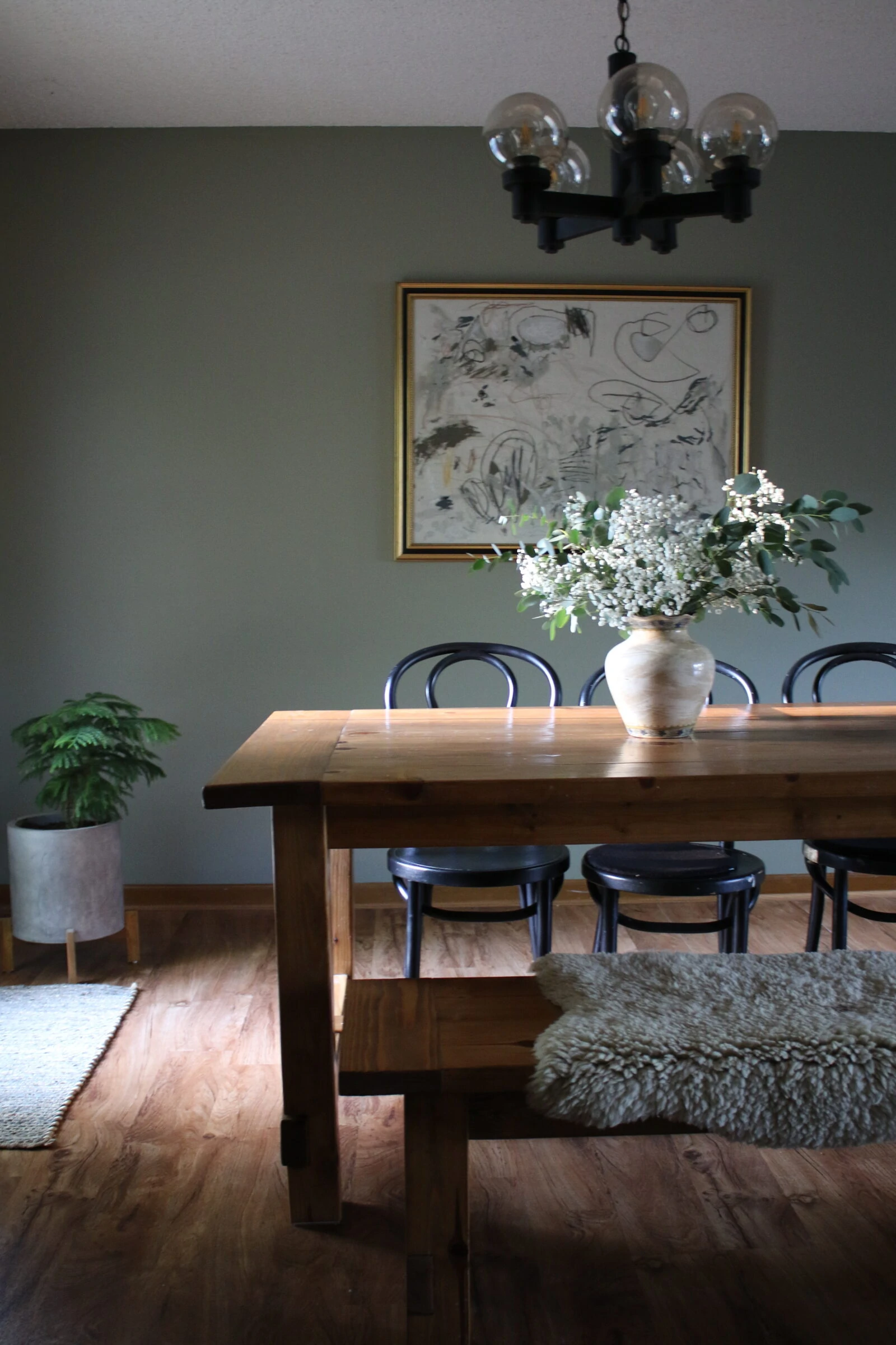 Dining Room featuring a wood table, black chairs with intentional living as the the focus