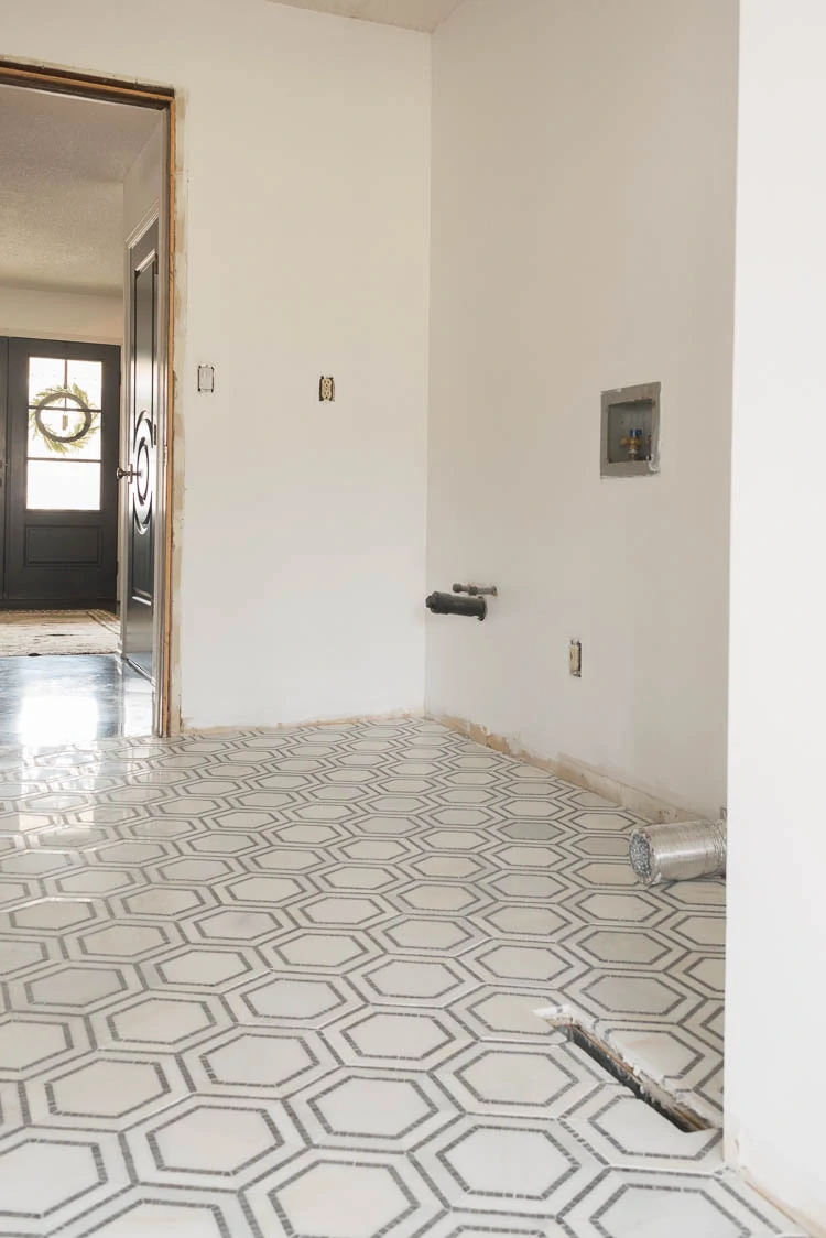 laundry room hexagon marble tile installed