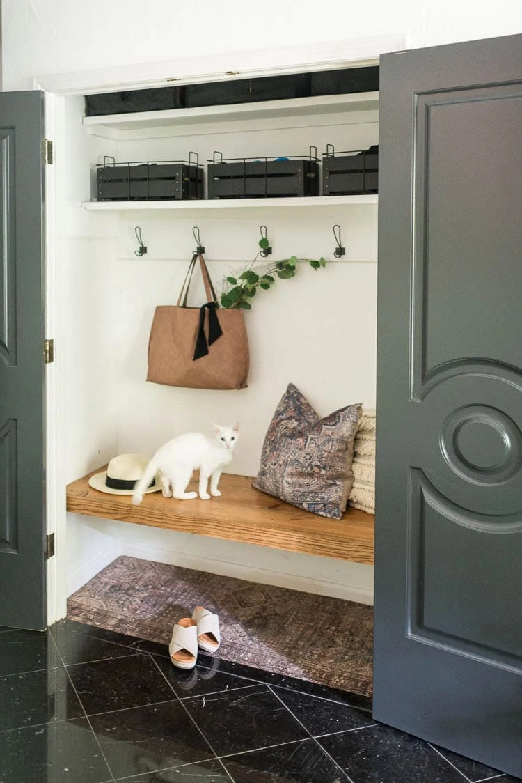 Coat closet bench with winter gear storage